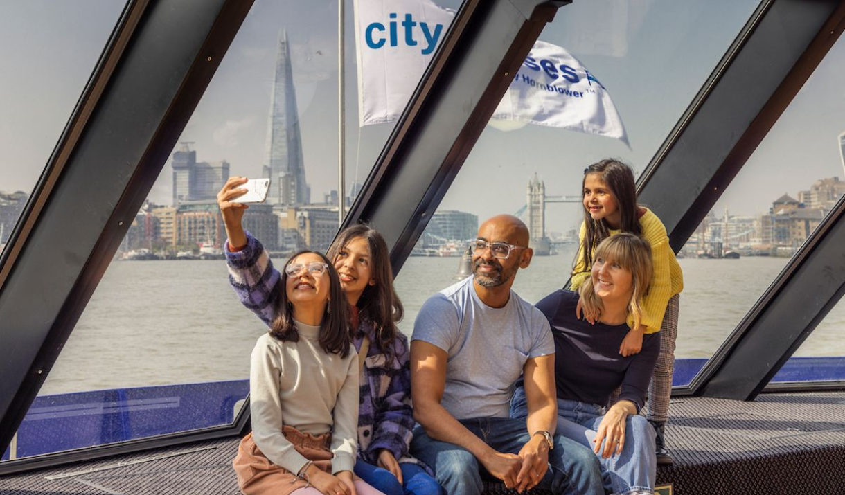 A family take a selfie on City Cruises to Greenwich